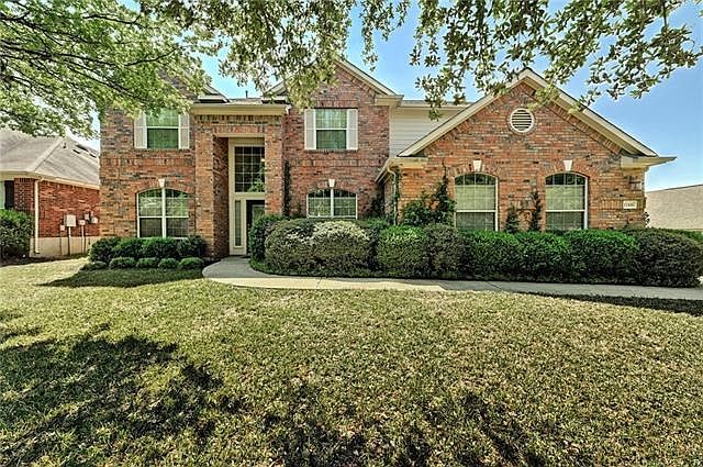 Stately four bedroom 3.5 bath home in desirable Barker Ranch in Shady Hollow features 4 side masonry, oversided lot with mature trees, strong school track and pool.