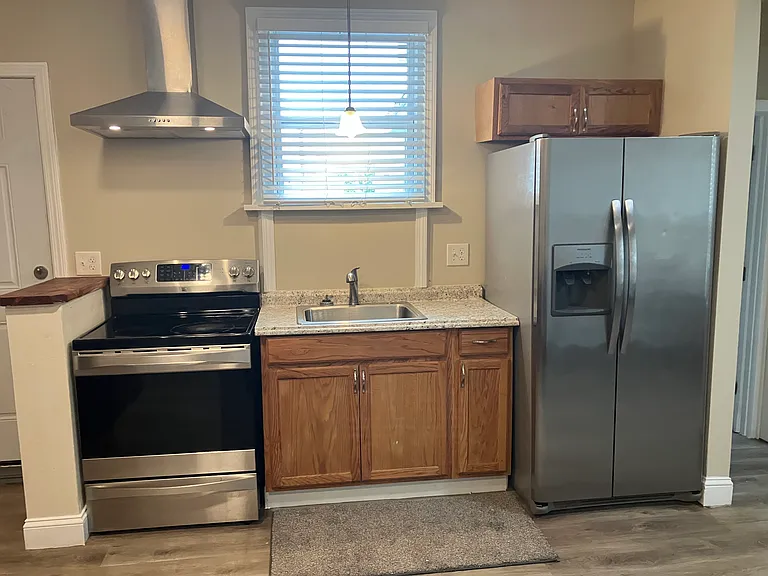 Full kitchen with stainless steel appliances