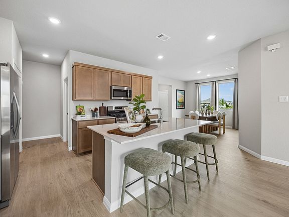 Kitchen in the Oak home plan by Trophy Signature Homes - REPRESENTATIVE PHOTO