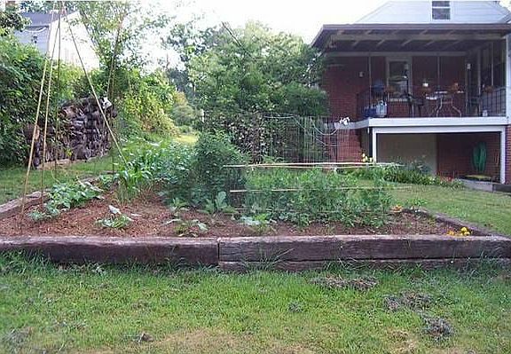 Patio above garage (Ignore garden, we removed it this year after photo)