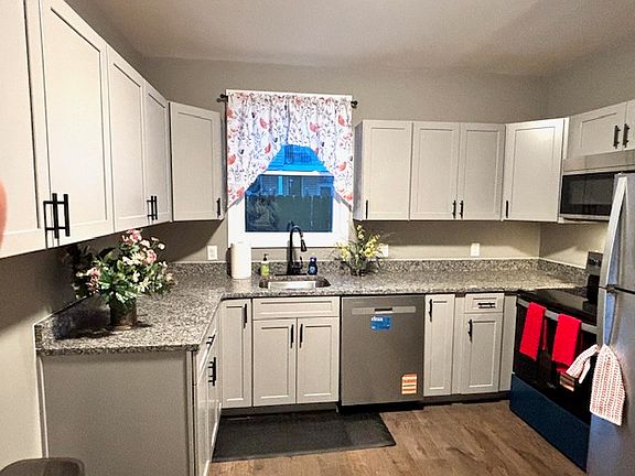 Brand new cabinets, stainless steel appliances with granite countertops