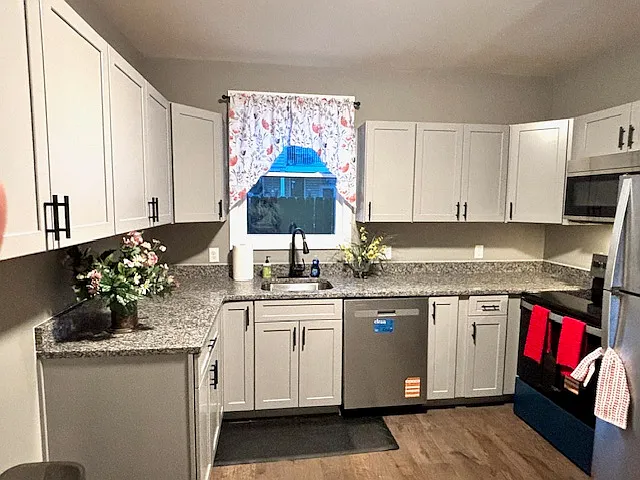 Brand new cabinets, stainless steel appliances with granite countertops