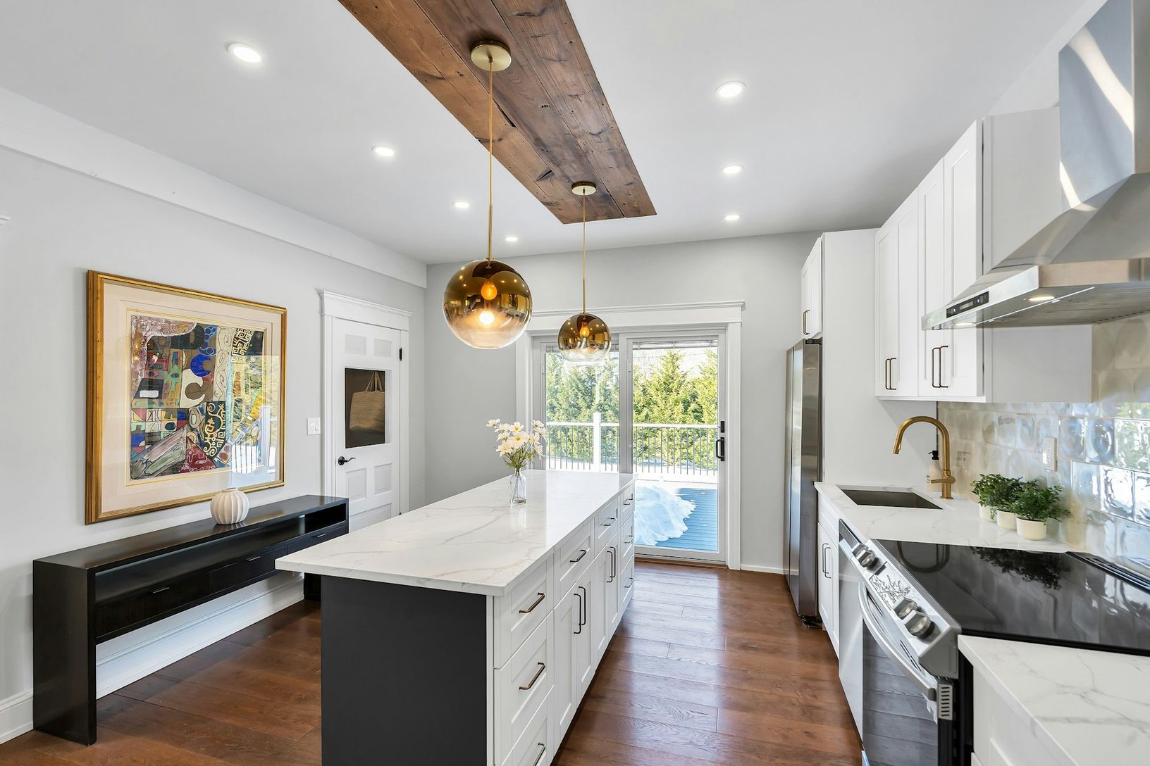  Open kitchen flows through new Andersen french doors leading to a large, brand new deck.