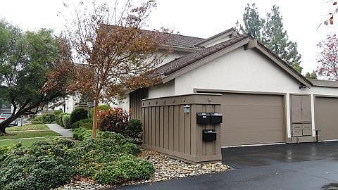 View of garage and mailbox