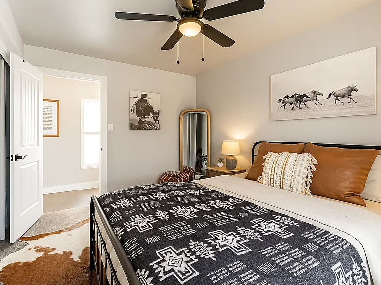 Spacious, serene, and beautifully styled_this queen bedroom blends comfort and charm with a modern Western flair.