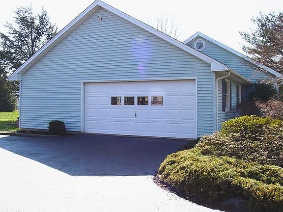 Side Turned Two Car Garage has Workshop