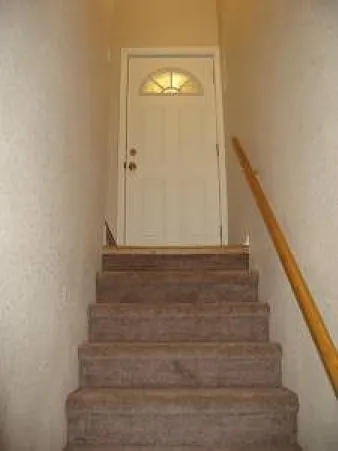 Back door with access to the kitchen and downstairs