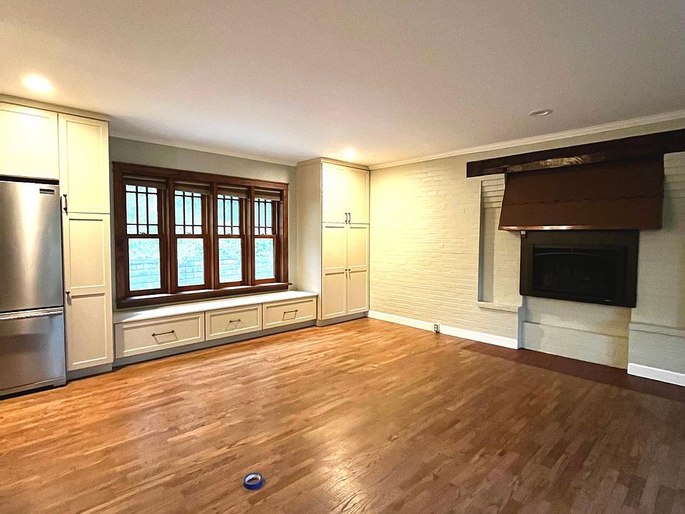 Open concept kitchen/living room on main level with gas fireplace.