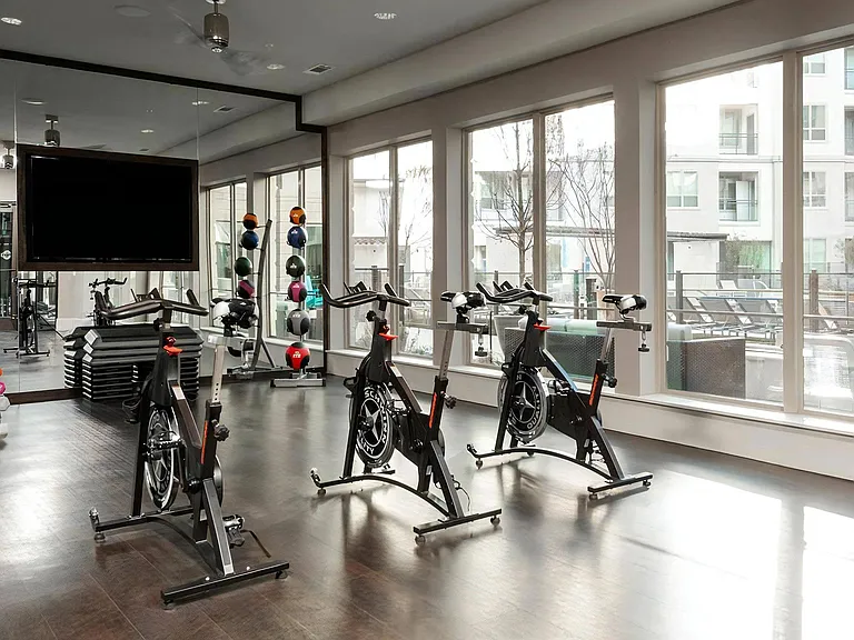 Bright Spin Studio Featuring Indoor Bikes, Large TV, and Scenic Outdoor Views