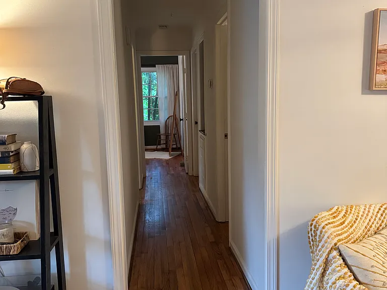 Hallway - looking from living room; first door on the right is the guest bath, second door on the right is the Master bed/bath, first door on the left is the third bed/home office, and room on the end is the second bedroom.