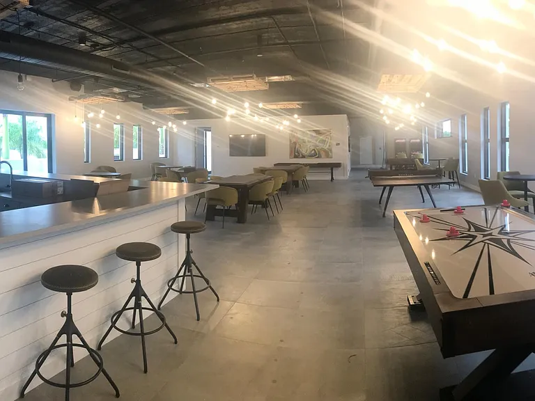 Ent./Game Room- bar, with ice machine and refrigerators, large screen TV's, air hockey, Foosball, Shuffleboard, ping-pong, video arcade games, poker & card tables, board games and a theater
 Entertain your friends here. Just bring your refreshments an