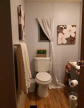 Small bathroom with shower off the entrance way