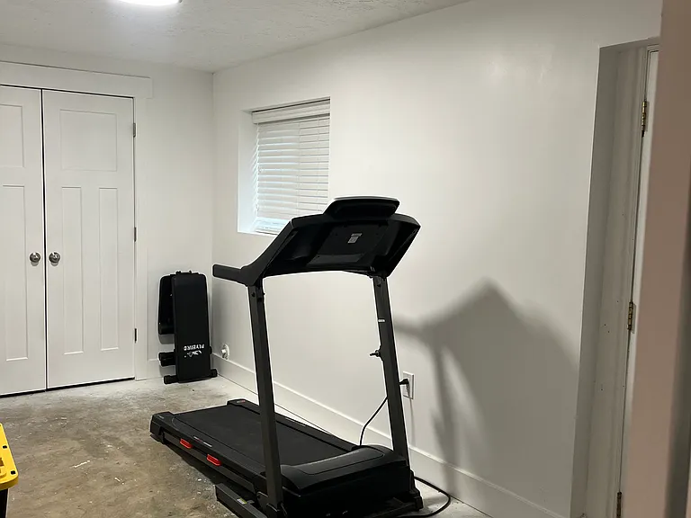 gym downstairs and closet. Door on right leads outside