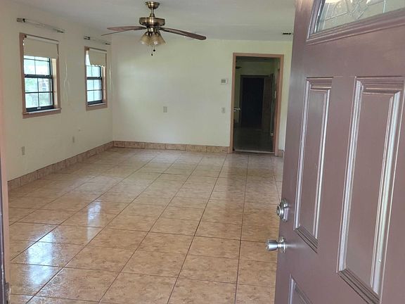 Front house entrance into the living room and dining room.