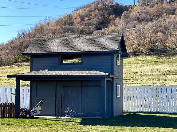 Large storage shed. Riding mower available for use.