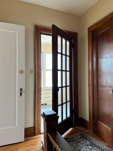 Landing, sunroom, and coat closet