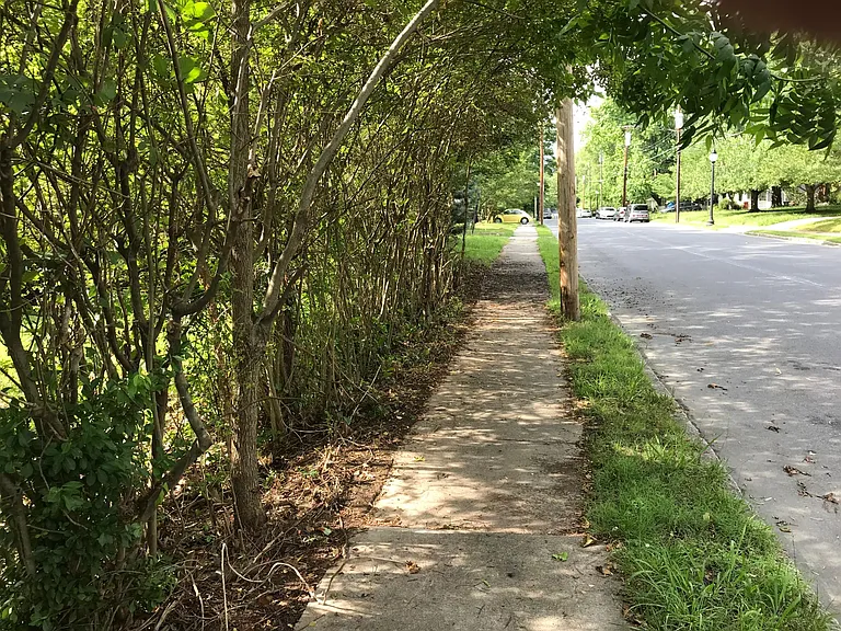 Sidewalk along complex and extra lot. Superb neighborhood.
