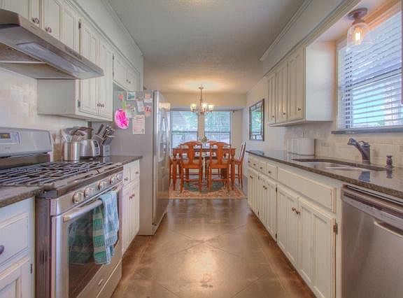 Remodeled kitchen with granite and new appliances.
