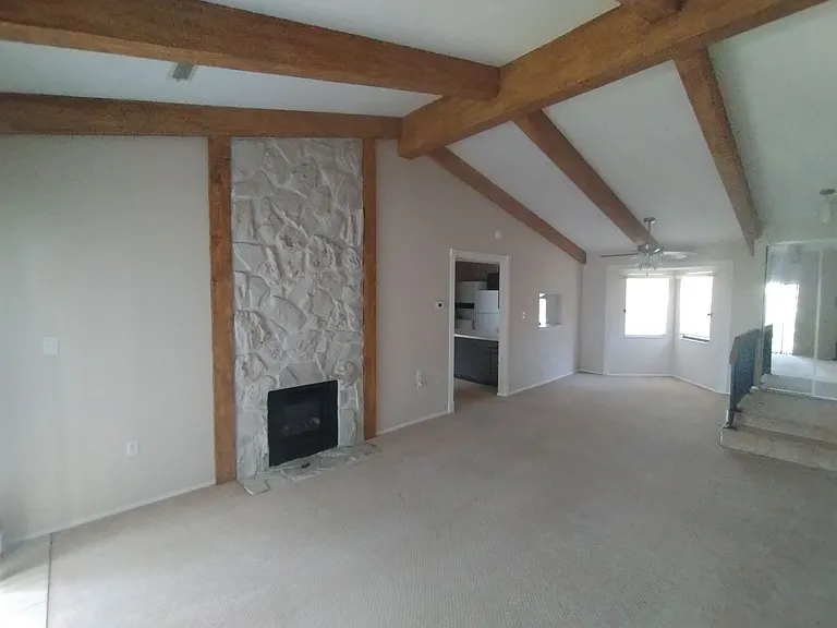 Living room with vaulted ceiling