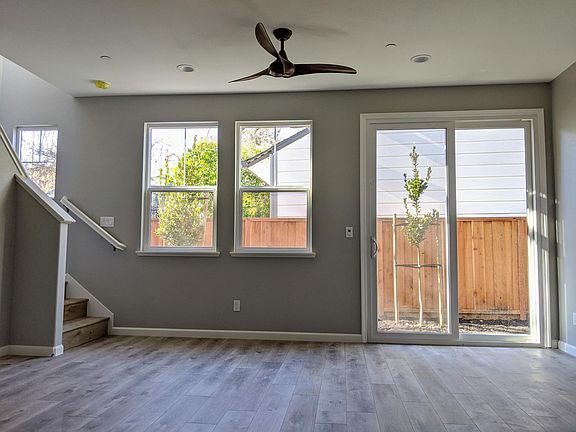 Open living room and sliding door to small, private back yard (sample photo unit 2-5, some units are mirror image).