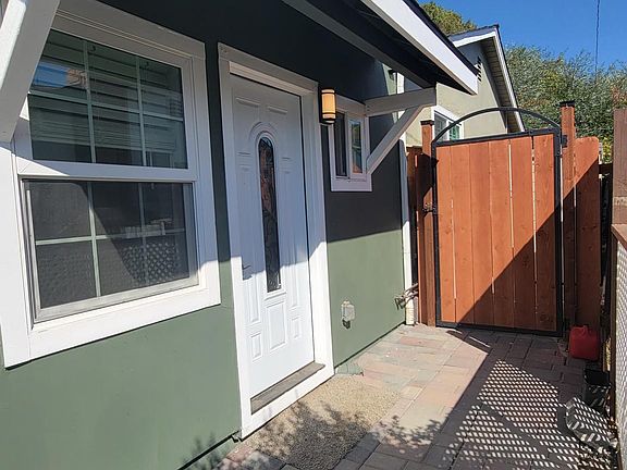 View of Entry door, and Gated private shed area
