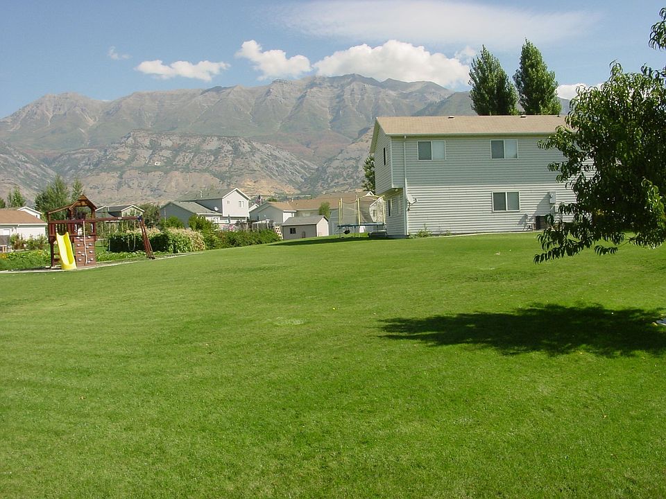 Side of house, back yard, mountain views, playset