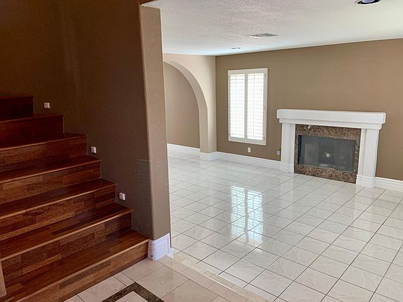 Taken from inside the front door, looking right. Shown is the base of the stairway, and the family room.