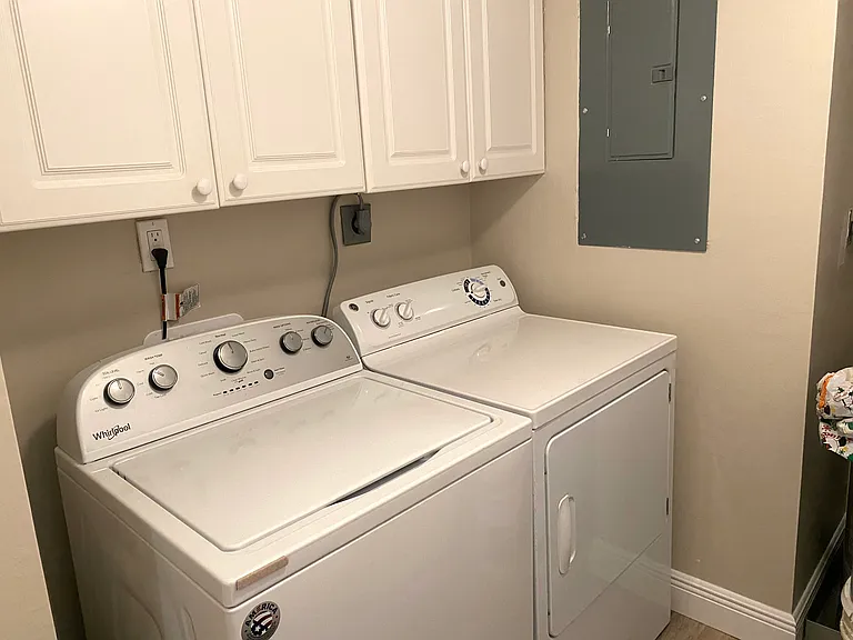 In unit laundry room with lots of storage