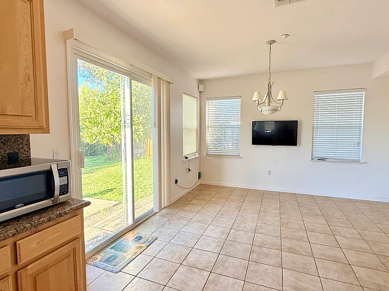 Kitchen dining area with backyard access