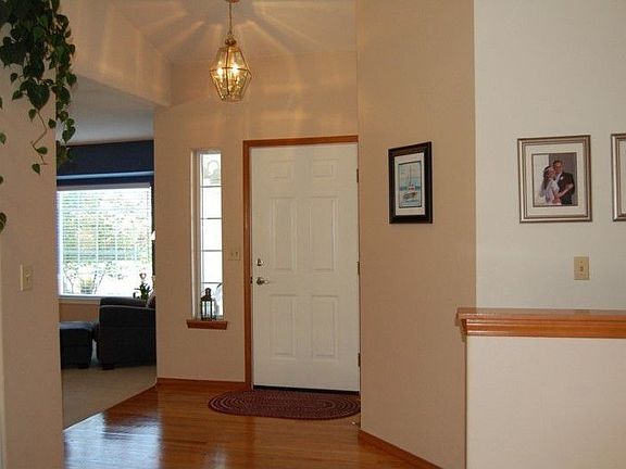 Hardwood entry...vaulted ceilings here and in the family room. An exceptional Rambler !