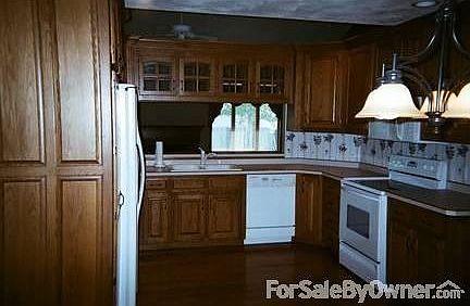 Kitchen : standing in eating area taking picture.