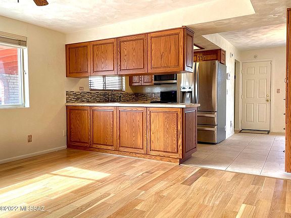 Family room off kitchen. Hardwood floor.