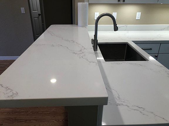Quartz countertop , new stainless fixtures, gourmet chef's sink, sit up bar