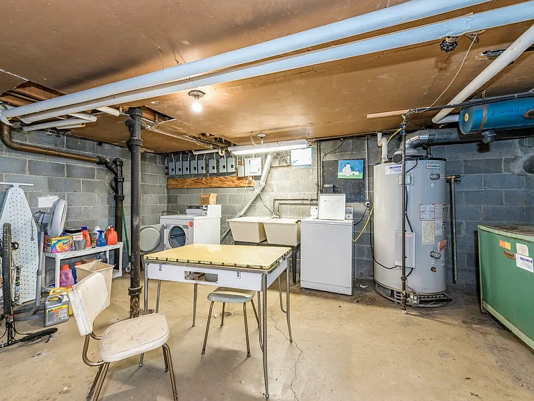 Coin operated washer and dryer in basement
