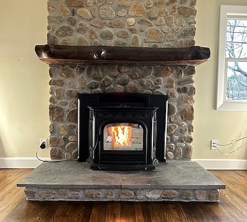 Pellet stove with auto features and fully thermostat controlled
