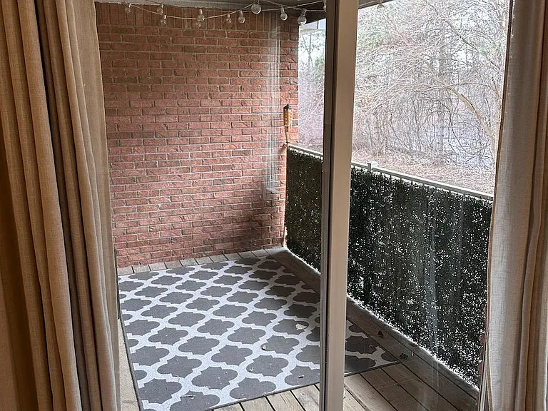 Balcony -- Privacy fencing on railing, string lighting