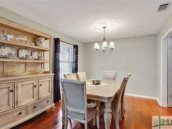 Dining room has space to accommodate your favorite dining table and beautiful floors