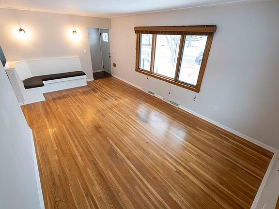 Front door on the right, leading into the main living room