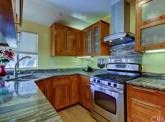 Sleek with granite counter and stainless appliances