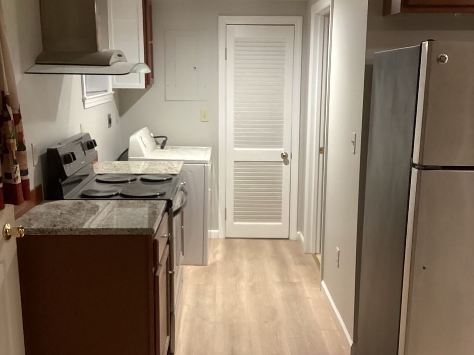 Kitchen with closet for storage. Dryer in unit.