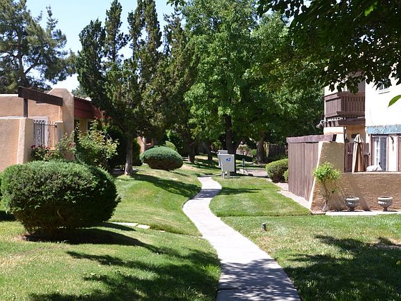 Abundant green spaces surround the Townhouse Condo