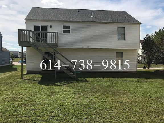 Back of house with 2 story deck