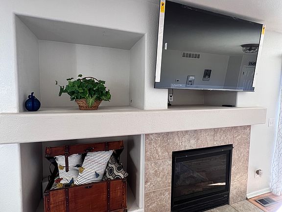 Working fireplace and brand new 65" smart TV, couch pillows, plants etc!