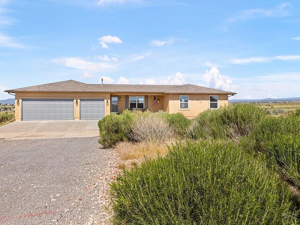 Front of House, with 3 car garage