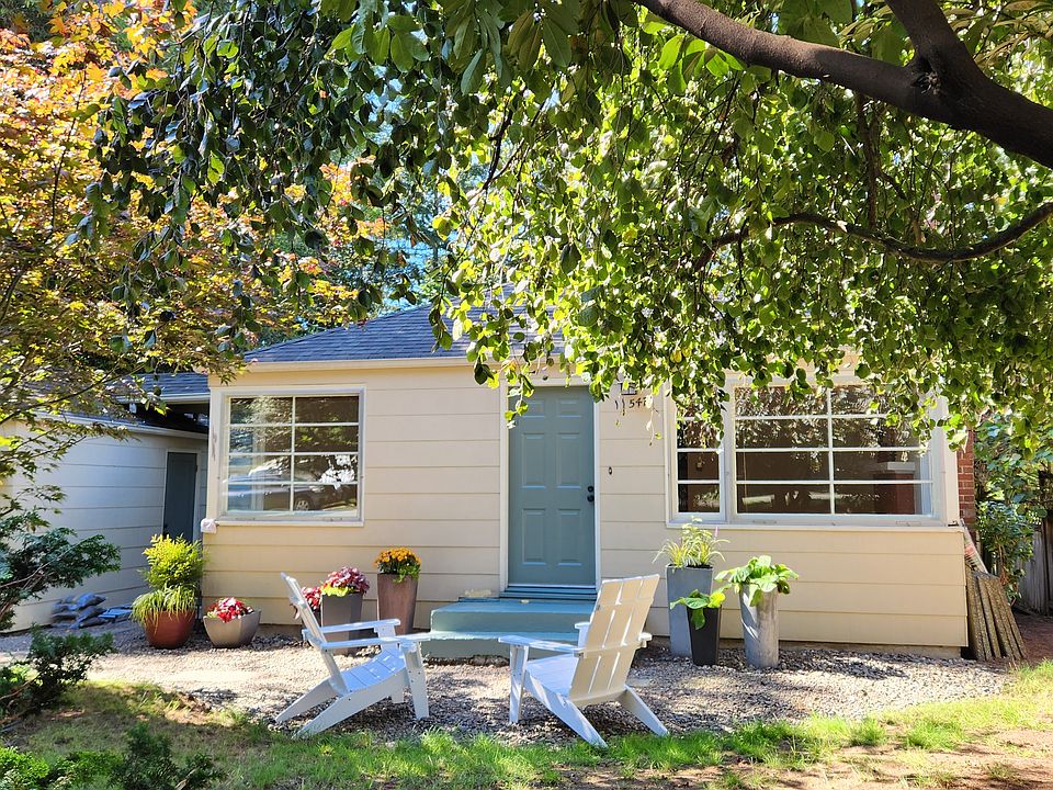 peek a boo view through front landscape from street