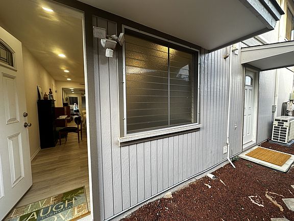Door to right to shared washer/dryer in garage.