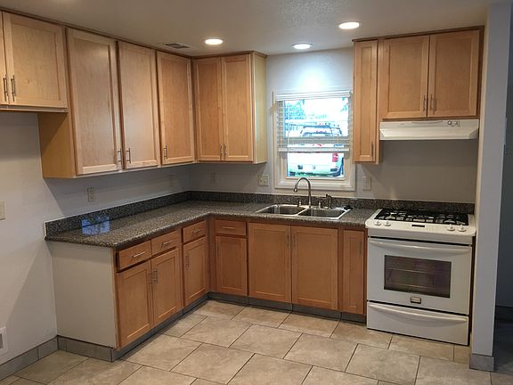 Kitchen comes equipped with a stove, oven, and refrigerator. The refrigerator was not present at the time of picture taking.