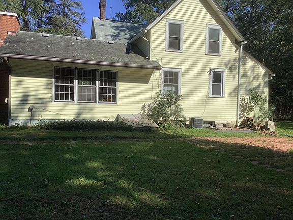 Back of house with patio