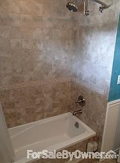 Remodeled hall bath/shower area
						:
						Brushed nickel fixtures, soaking tub, wainscoting, tiled front bath ledge