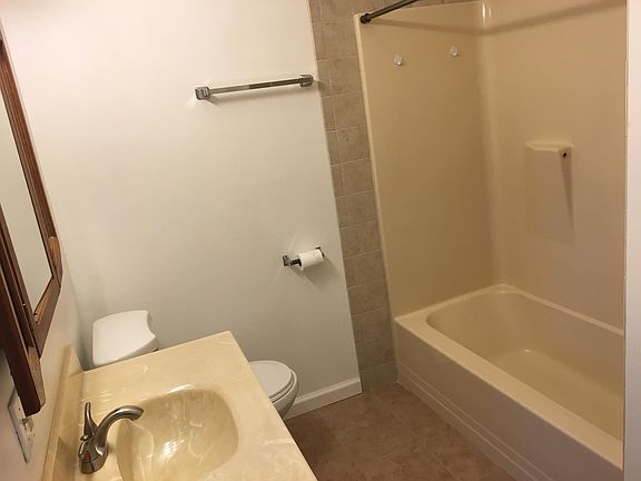 new tile floor and around tub in bathroom